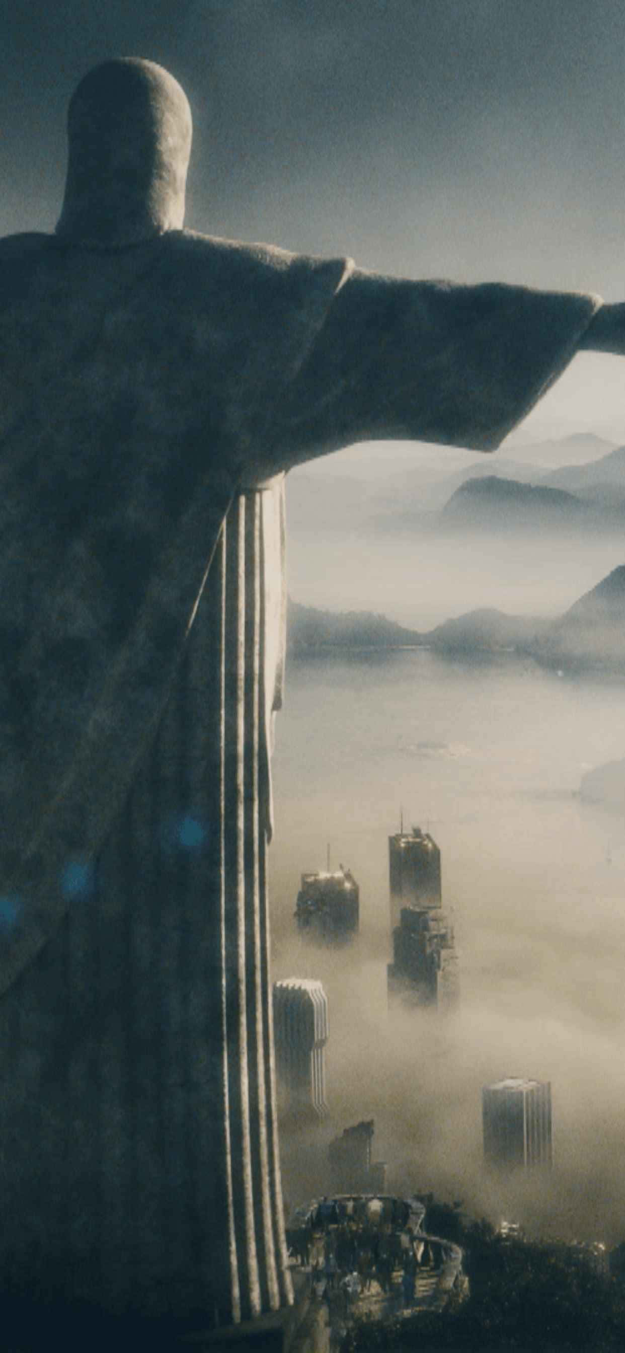 一座基督雕像，背景为城市 壁纸