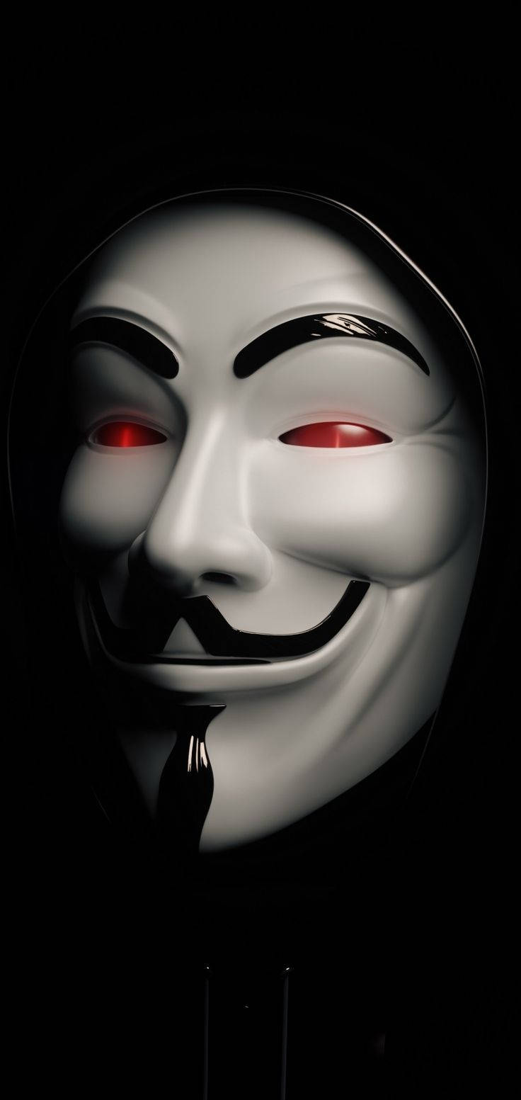 使用智能手机的盖伊·福克斯面具神秘男子 壁纸