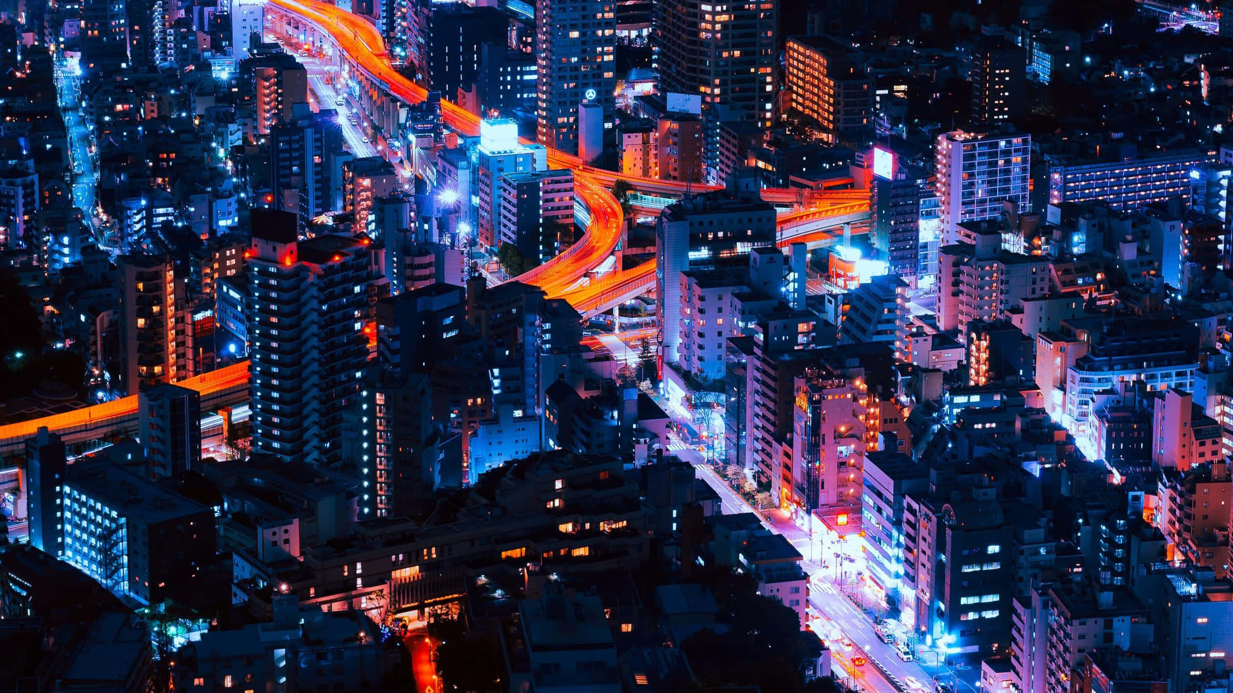 充满活力与动感的霓虹城市景观 壁纸