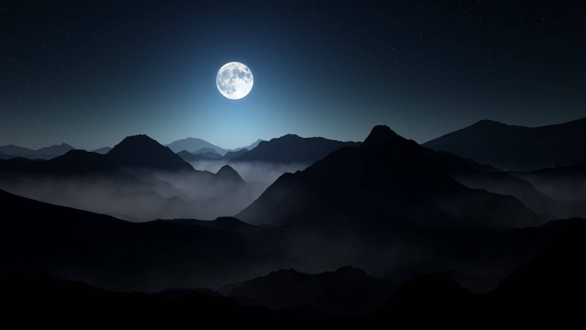 暗夜山峦中的笔记本电脑与满月