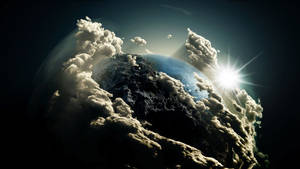 地球在黑暗外太空中的云层壁纸